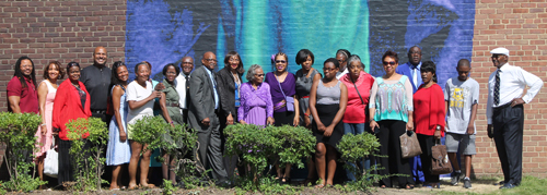 Posing in front of the new Ruby Dee mural at Karamu House