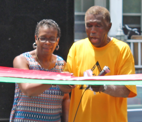 Eugene Jordan and former Councilwoman Sabra Pierce Scott cut the ribbon for Phase 1 in the African American Garden in Cleveland