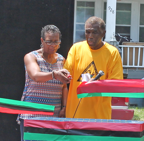 Eugene Jordan and former Councilwoman Sabra Pierce Scott cut the ribbon for Phase 1 in the African American Garden in Cleveland