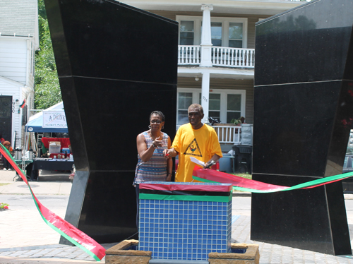 Eugene Jordan and former Councilwoman Sabra Pierce Scott cut the ribbon for Phase 1 in the African American Garden in Cleveland