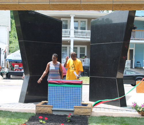 Eugene Jordan and former Councilwoman Sabra Pierce Scott cut the ribbon for Phase 1 in the African American Garden in Cleveland