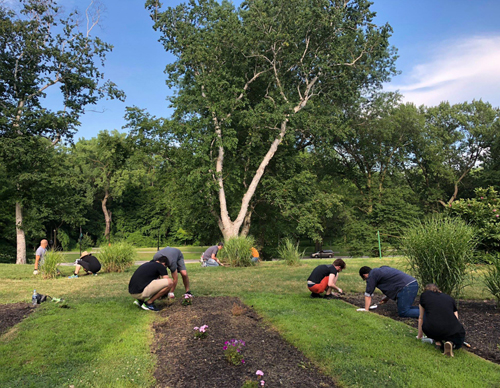 Jewish and African American volunteers work together in the African American Cultural Garden