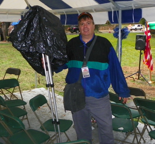 Dan Hanson soaked from rain Rain at the Albanian Cultural Garden Dedication