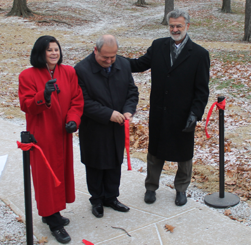 Dona Brady, Mayor Baftjar Zeqaj and Mayor Frank Jackson cut the ribbon