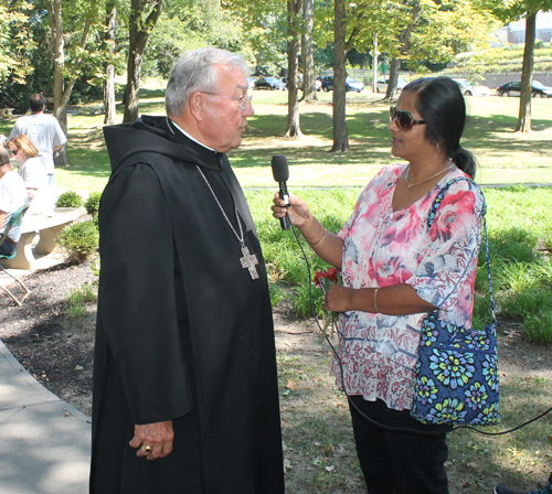 Bishop Roger Gries being interview for a Bengali station by Piya Roy