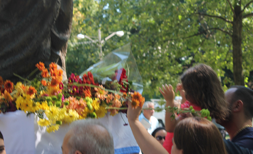Placing flowers on the statue