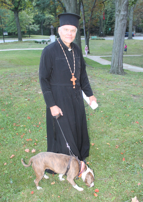 Priest with dog