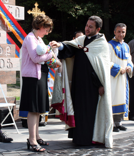 Fr. Martiros Hakobyan blesses Melanie Shakarian's baby