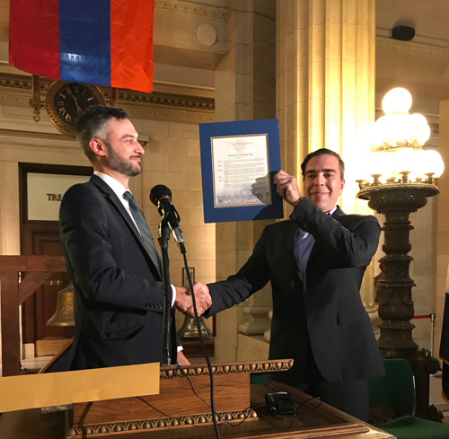 Alex Lackey from the City of Cleveland gives a proclamation from the Mayor to Rouben Sagatelov 