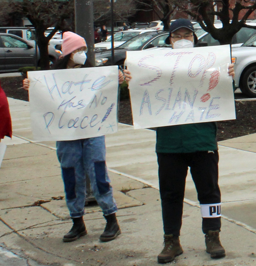 Corner signs Asian Hate March