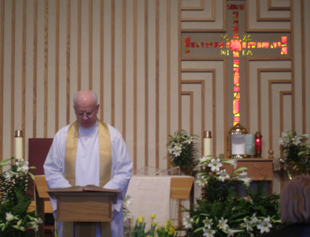 Father Hudak on the altar
