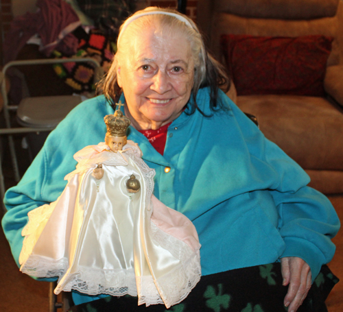 Pat Hanson with Infant of Prague statue