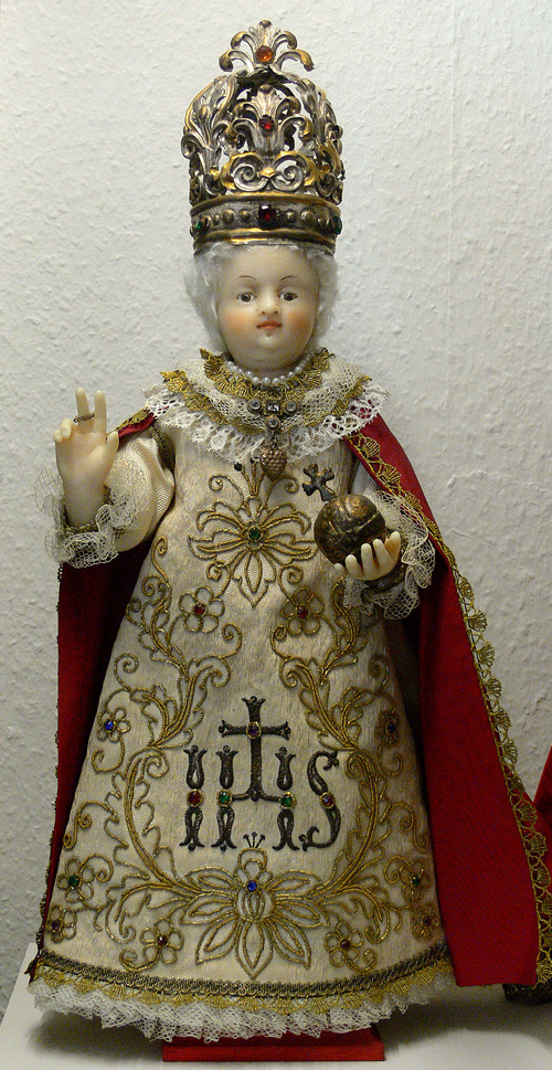 A German copy of the statue of the Infant of Prague, with a white wig instead of the traditional blonde hair, circa. 1870