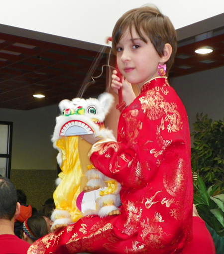 Child getting ready for Lion Dance