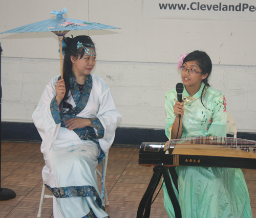 Demi Zhang plays the 21 string Chinese zither (guzheng) and her mother Bing Xu sings