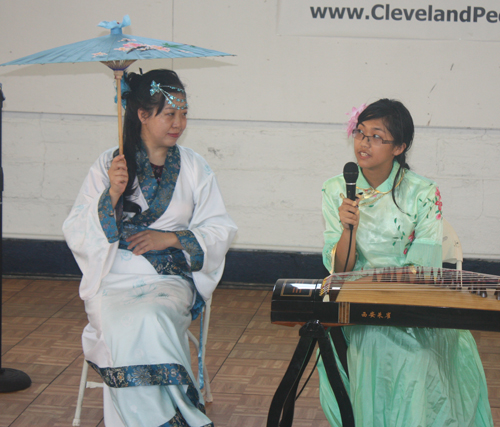 Demi Zhang plays the 21 string Chinese zither (guzheng) and her mother Bing Xu sings