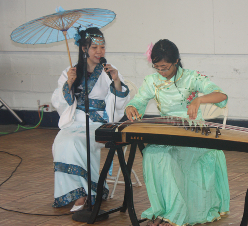 Demi Zhang plays the 21 string Chinese zither (guzheng) and her mother Bing Xu sings