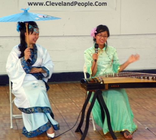 Demi Zhang plays the 21 string Chinese zither (guzheng) and her mother Bing Xu sings