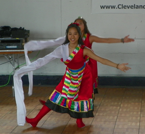 Dance from Tibet featuring a costume with one long sleeve
