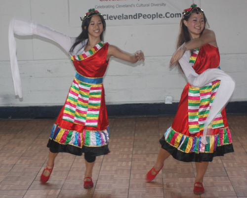 Dance from Tibet featuring a costume with one long sleeve