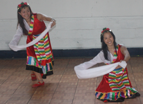 Dance from Tibet featuring a costume with one long sleeve