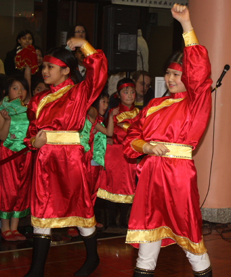 Young Chinese girls from Connie Zhang Acrobatic School perform an acrobatic dance