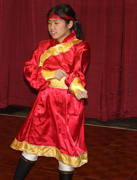 Young Chinese girls from Connie Zhang Acrobatic School perform an acrobatic dance