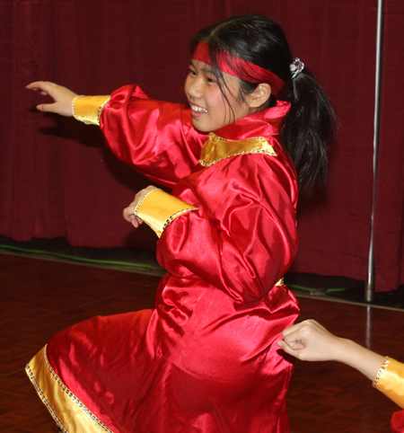 Young Chinese girls from Connie Zhang Acrobatic School perform an acrobatic dance