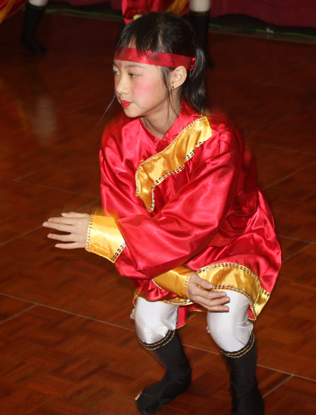 Young Chinese girls from Connie Zhang Acrobatic School perform an acrobatic dance