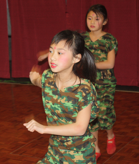 Young girls from Cleveland Contemporary Chinese Culture Association performed a Soldier dance at a Chinese New Year celebration at Asia Plaza in Cleveland