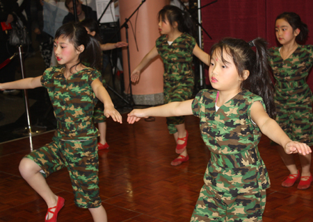 Young girls from Cleveland Contemporary Chinese Culture Association performed a Soldier dance at a Chinese New Year celebration at Asia Plaza in Cleveland