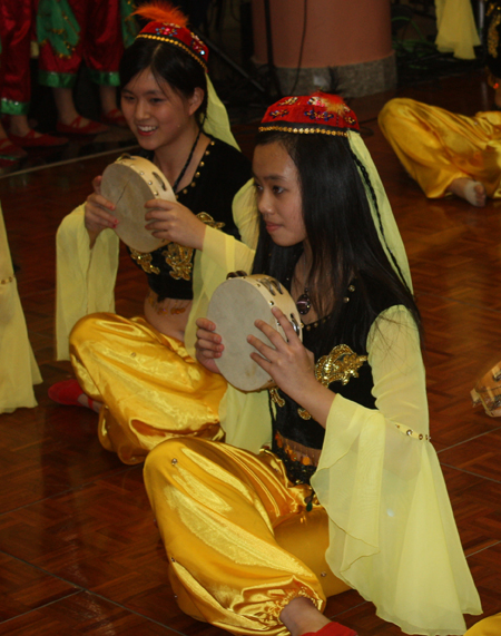 Chinese girls perform tanbourine dance