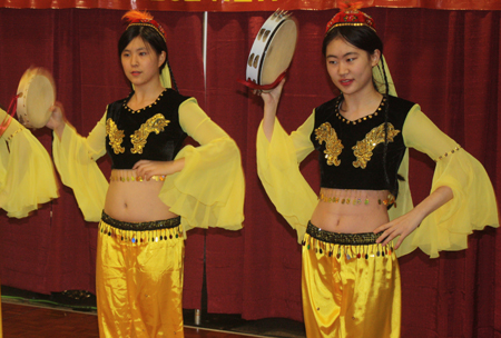 Chinese girls perform tanbourine dance