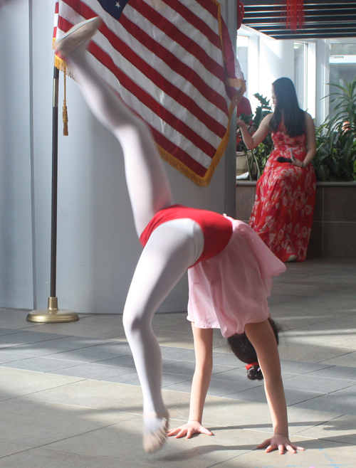 acrobatic performance by young people in traditional Chinese costumes