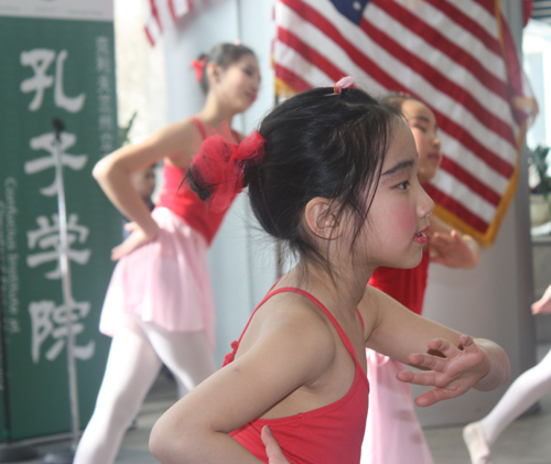 acrobatic performance by young people in traditional Chinese costumes