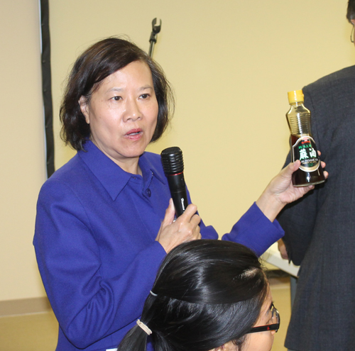 Judy Wong shows a sesame oil 