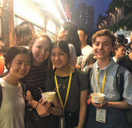 Eating our creation of the Chinese snack called San Da Pao from the snack stand at Kuanzhai Alley