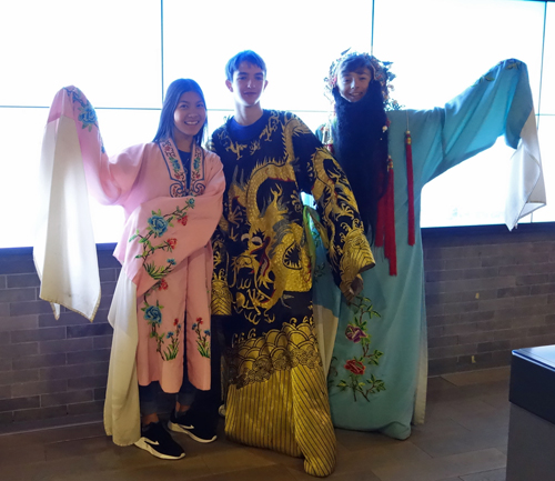 Trying the traditional costume at the Confucius Institute Headquarters