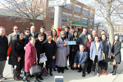 Posing with the new Stanley Eng Street Sign