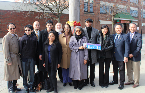 Posing with the new Stanley Eng Street Sign