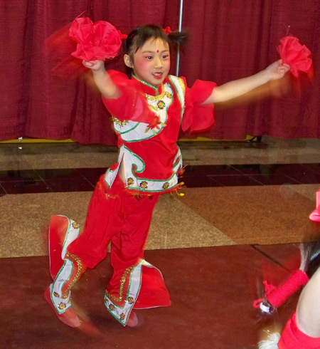 Chinese girls perform acrobatic dance for New Years