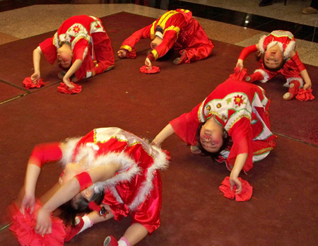 Chinese girls perform acrobatic dance for New Years