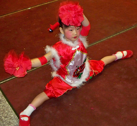 Chinese girls perform acrobatic dance for New Years