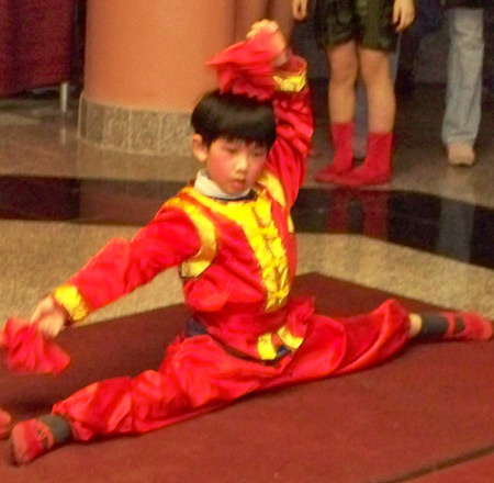 Chinese boy perform acrobatic dance for New Years