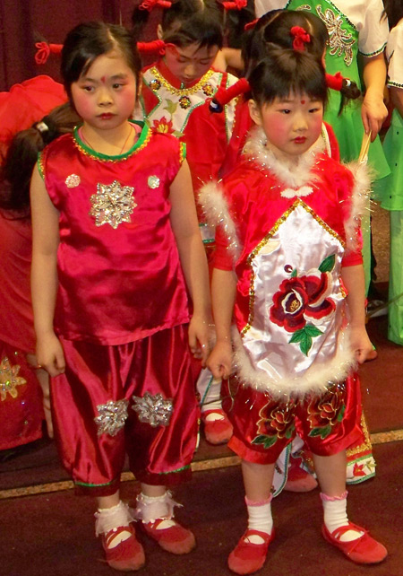 Chinese girls perform acrobatic dance for New Years