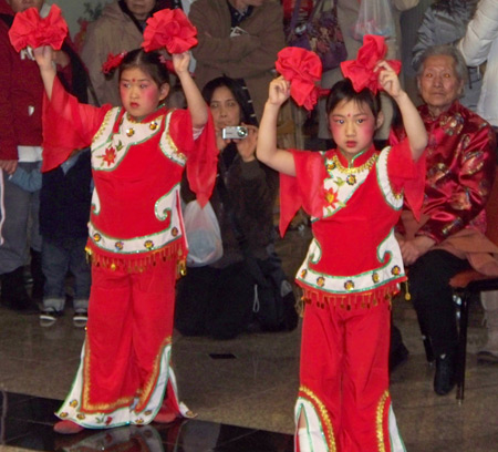 Chinese girls perform acrobatic dance for New Years