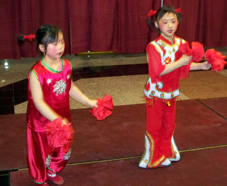 Chinese girls perform acrobatic dance for New Years