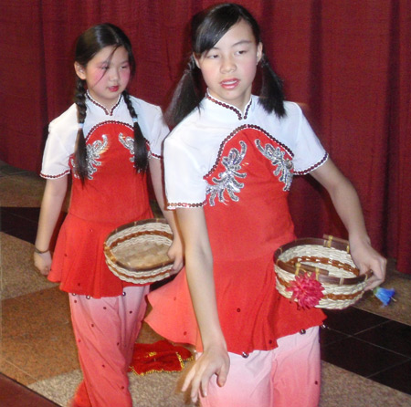 Chinese girls perform acrobatic dance for New Years