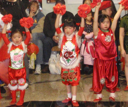 Chinese girls perform acrobatic dance for New Years