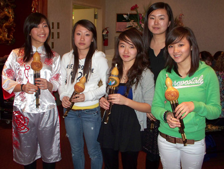 Chinese girls with hulusi flutes
